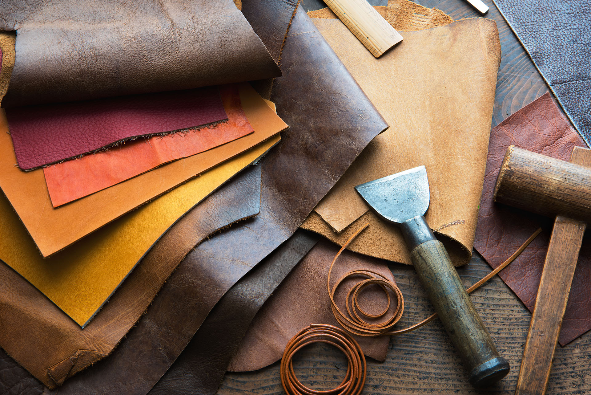 Leather materials and tools representing the luggage repair services of Klumpps Leather & Luggage in Grand Rapids, MI